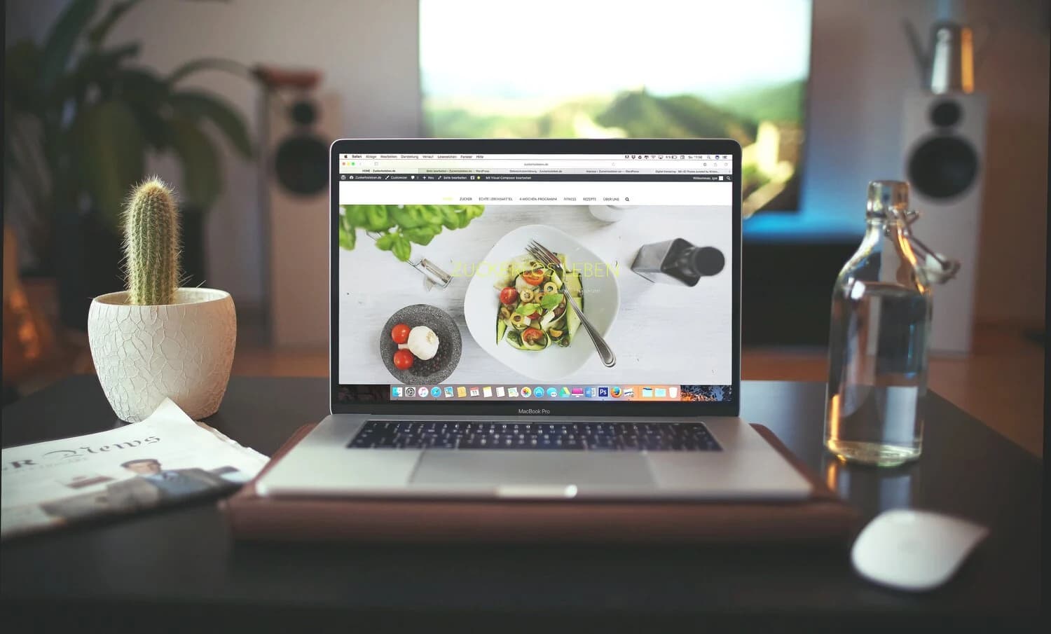 Laptop showing a website on a desk.