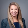 woman smiling in blazer